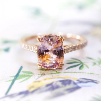 Peachy-pink sapphire engagement ring