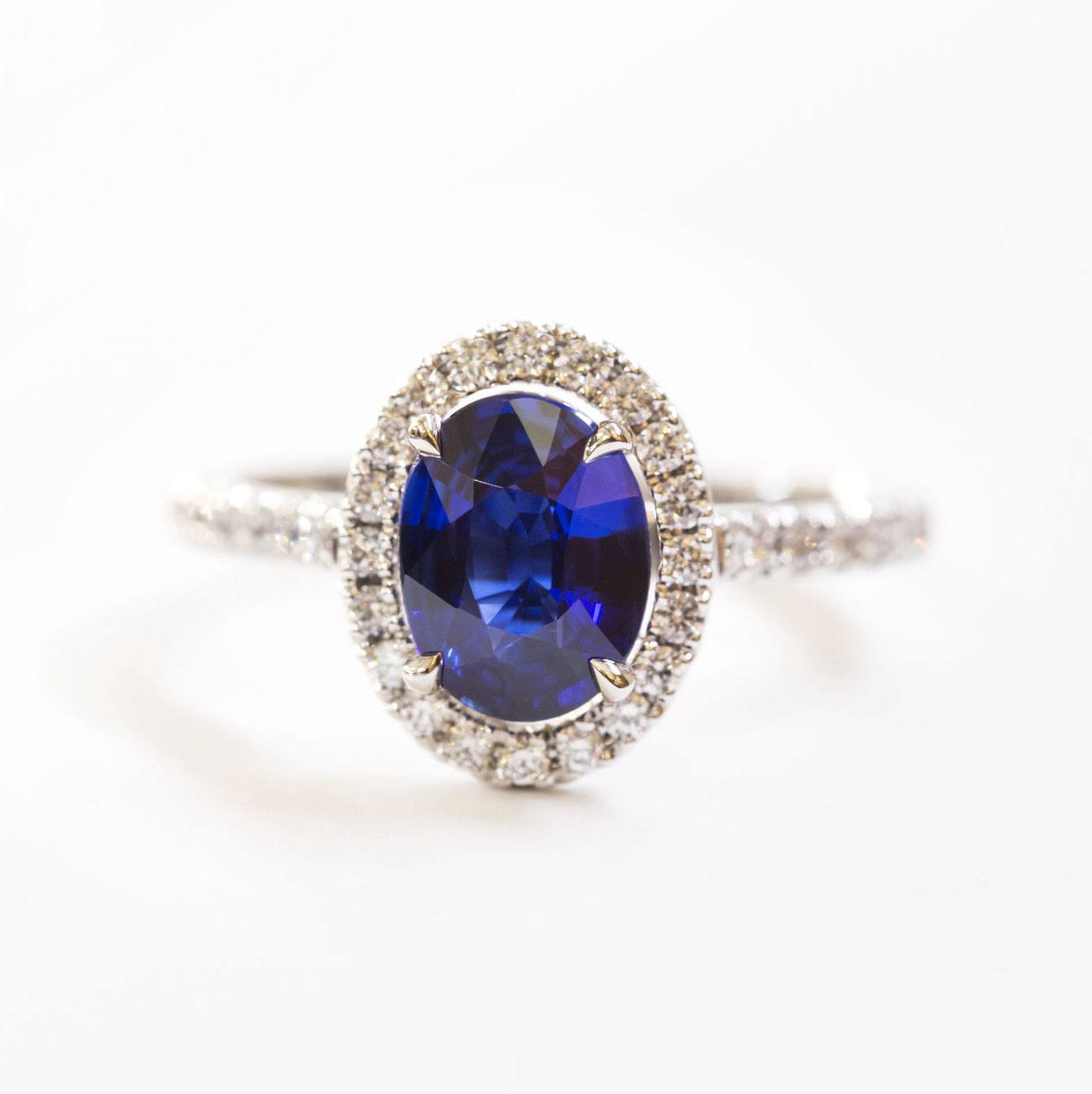 Blue sapphire and diamond halo ring