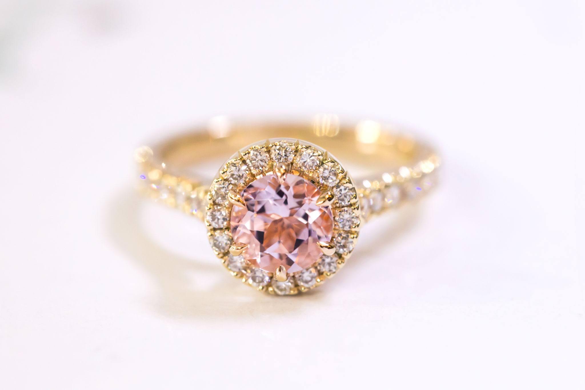 Morganite and diamond halo engagement ring
